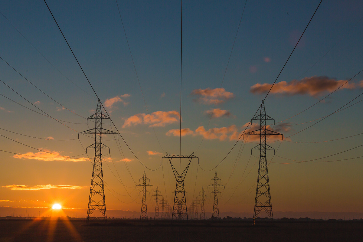 Low voltage powerlines and clouds at sunset
